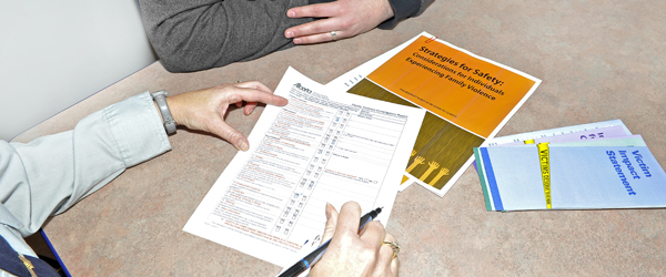 RCMP officer completing a FVIR form