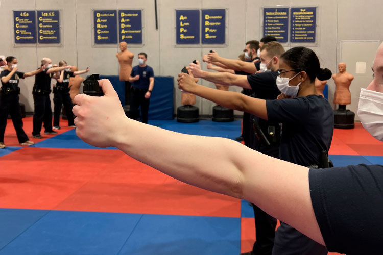 Cadets lined up learning how to use OC spray