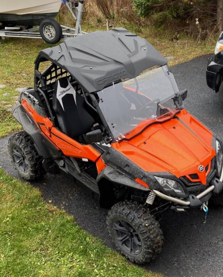 A photo of an orange 2021 CF Moto side by side with NL plate VHV250.
