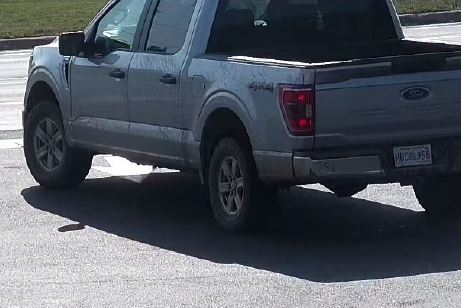 Silver 2023 Ford F150 pickup truck, covered in mud, with possible Nova Scotia licence plate HDC 958.