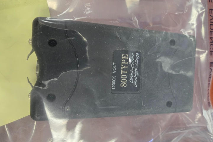 A stun gun inside a clear evidence bag.